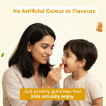 Mother feeding child a tasty gummy - No artificial colours or flavours formulation that kids enjoy | #flavour_mango