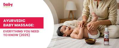 Mother giving Ayurvedic oil massage to a smiling baby in natural daylight