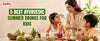 Ayurvedic summer drinks for kids including Gulkand Milk, Variyali Sherbet and Aam Panna displayed in clay pots and glasses on a wooden tray