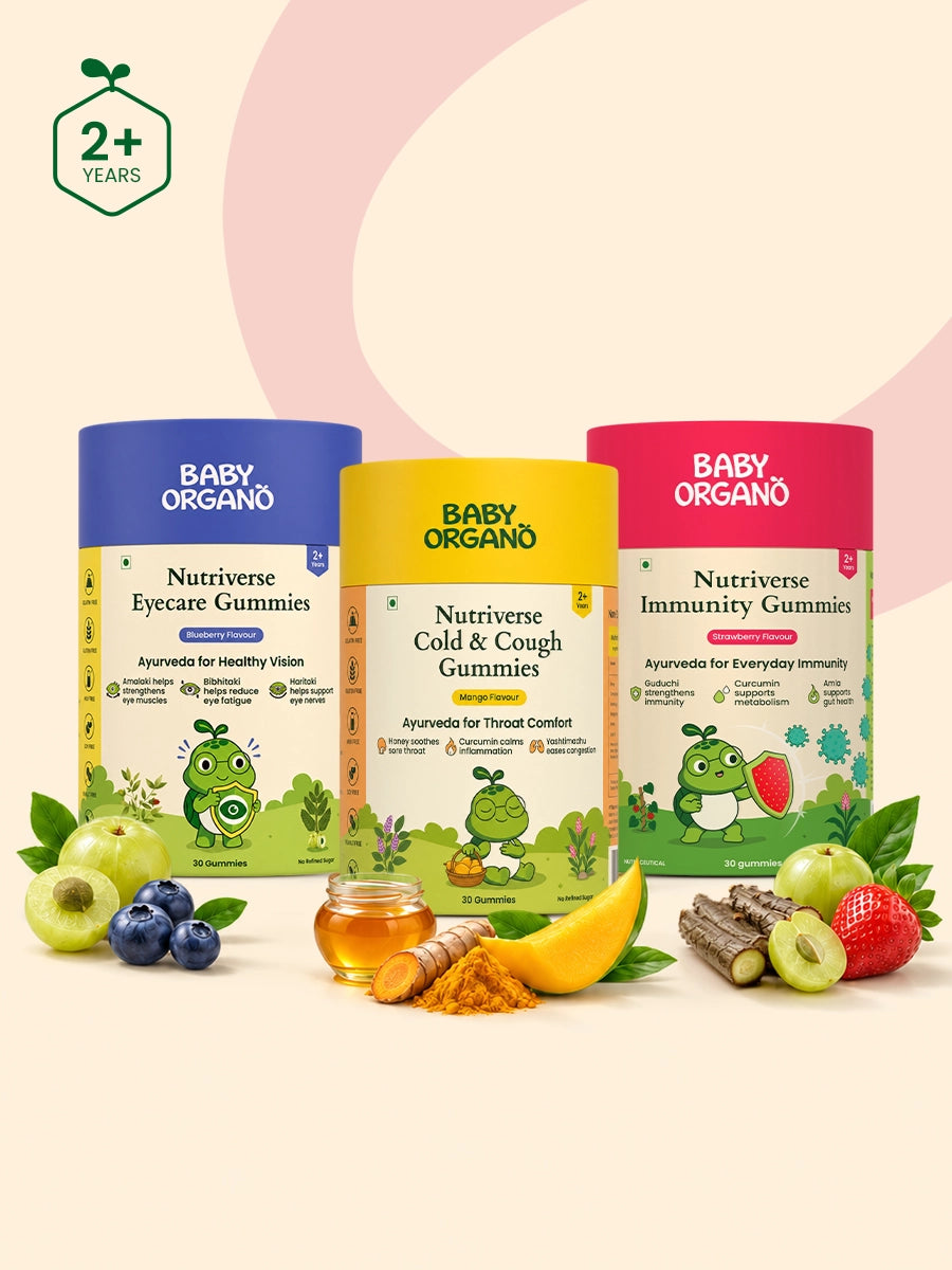 Three containers of BabyOrgano Nutriverse gummies surrounded by fresh ingredients including blueberries, mango, honey, turmeric, and strawberries.