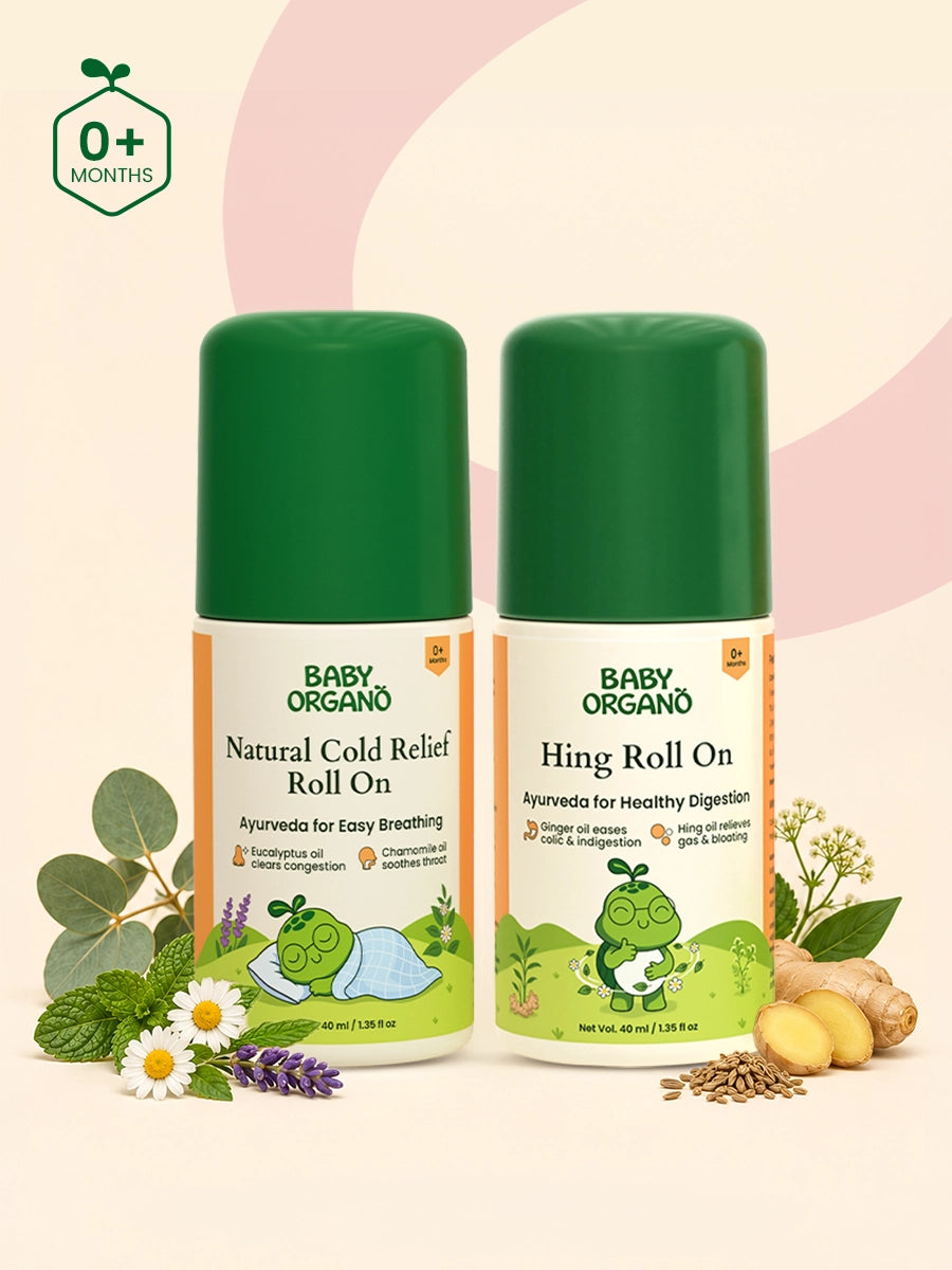BabyOrgano Natural Cold Relief Roll On and Hing Roll On bottles presented side by side with chamomile flowers, mint leaves, eucalyptus, and ginger root.