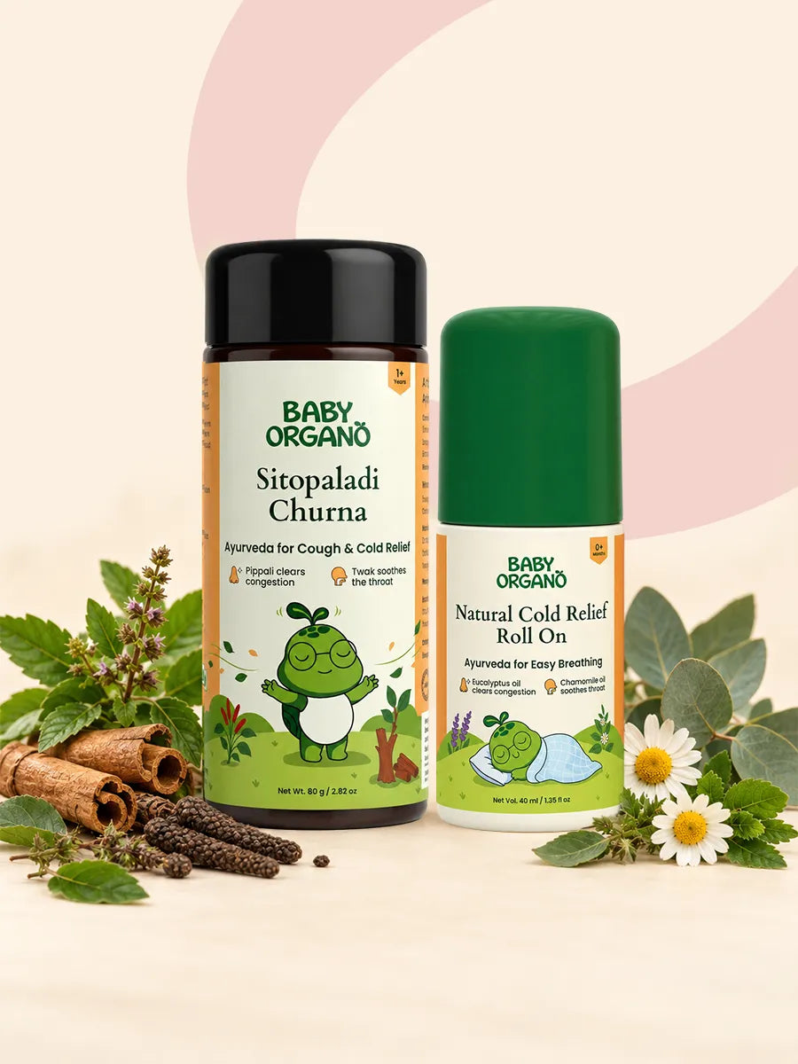 BabyOrgano Sitopaladi Churna container and Natural Cold Relief Roll On bottle surrounded by cinnamon sticks, pippali, and chamomile flowers.