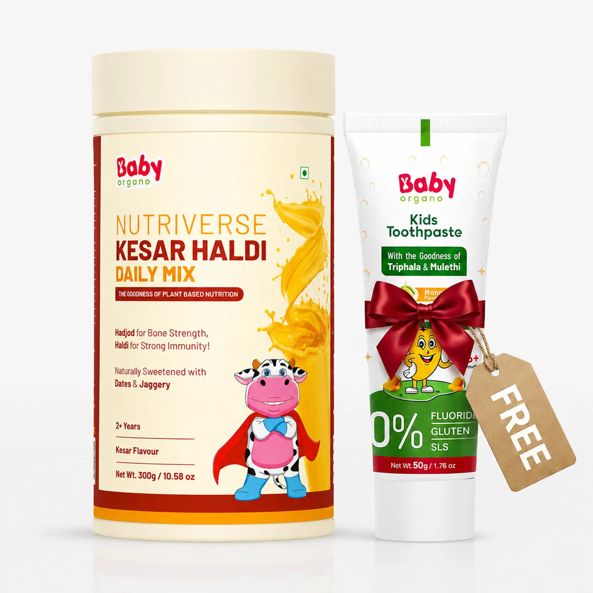 Baby Organic Nutriverse Kesar Haldi Daily Mix powder container shown next to a tube of Kids Toothpaste with a red ribbon and a brown 'FREE' tag, on a white background.