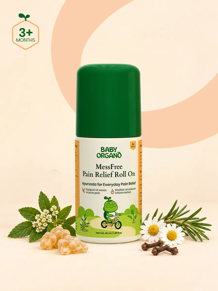 BabyOrgano MessFree Pain Relief Roll On bottle surrounded by natural ingredients.