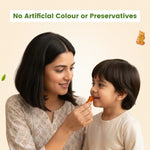 Mother giving a pineapple-flavored Nutriverse Immunity Gummy to her happy child, emphasizing the formula has no artificial colours or preservatives | #flavour_pineapple