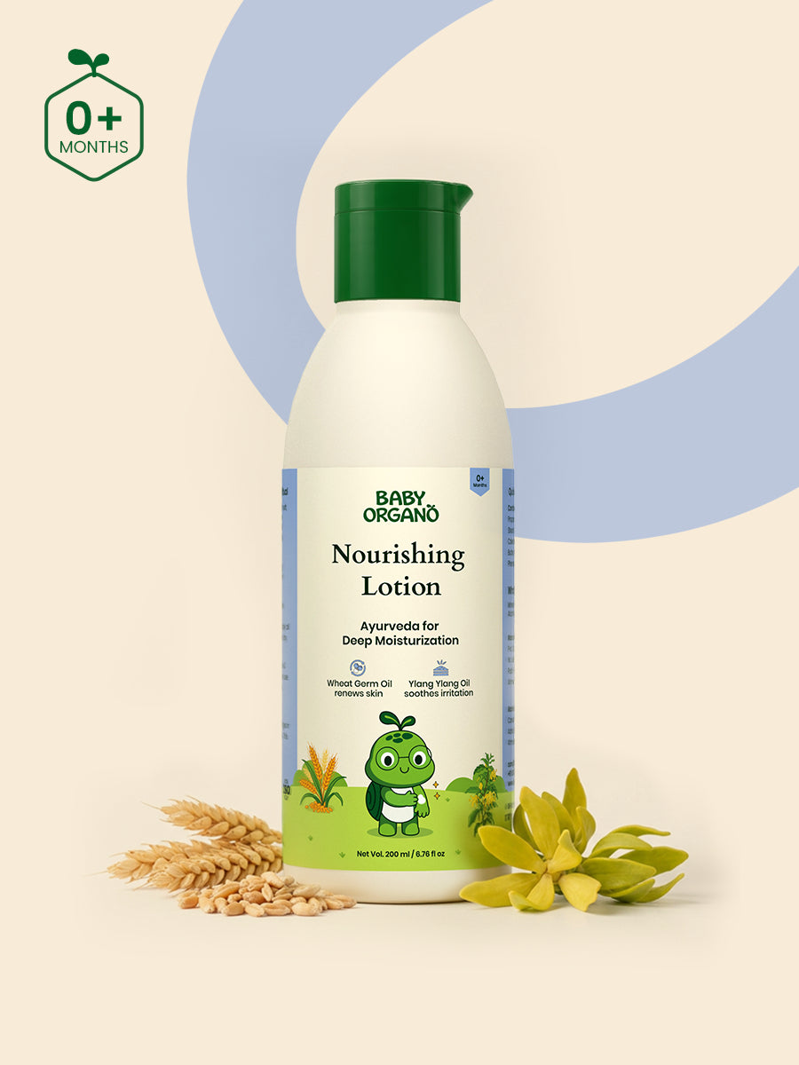 BabyOrgano Nourishing Baby Lotion bottle placed beside natural wheat stalks and ylang-ylang flowers.
