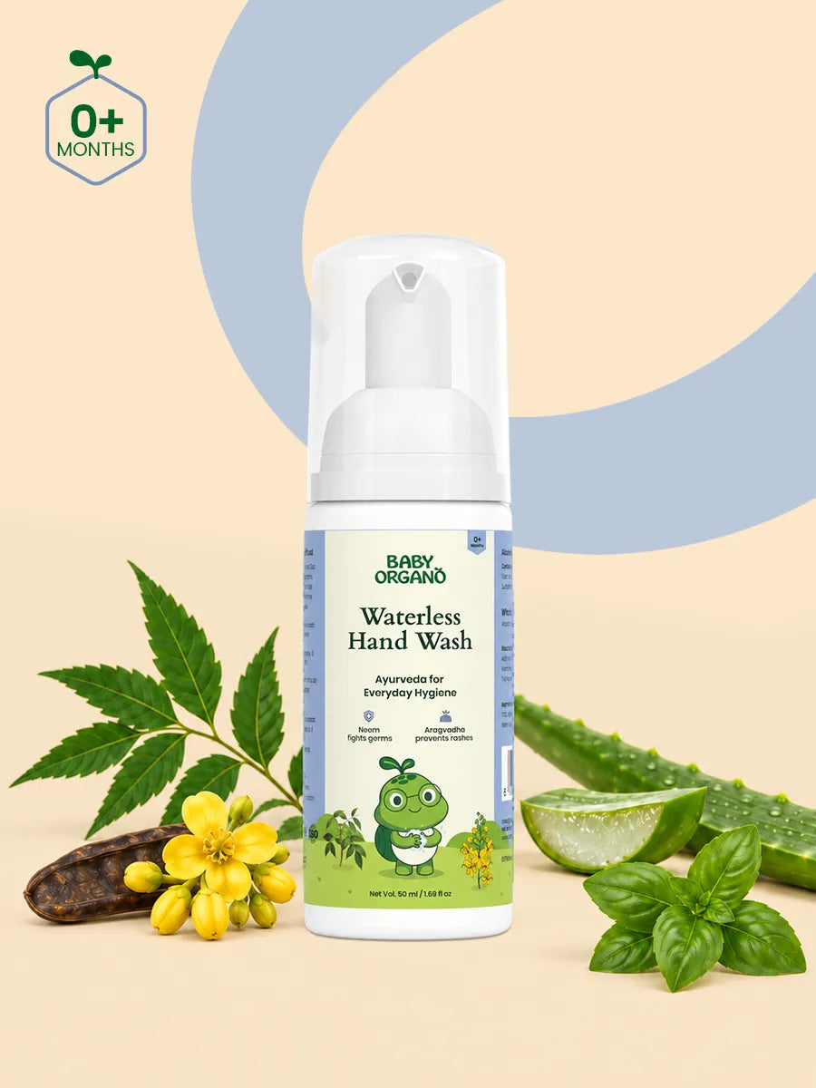 BabyOrgano Waterless Hand Wash bottle surrounded by natural ingredients like neem leaves, aloe vera, and yellow flowers.